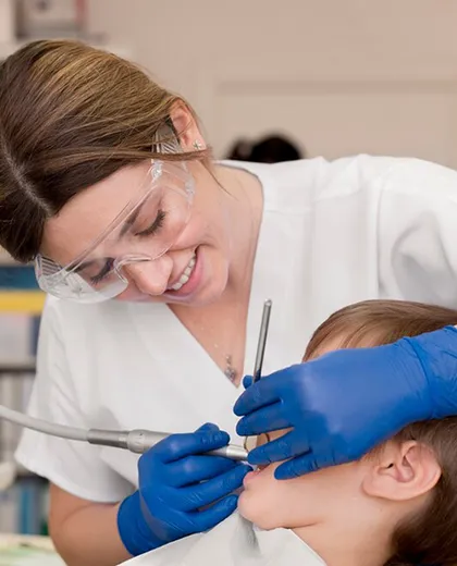 Friendly dentist treating a child patient